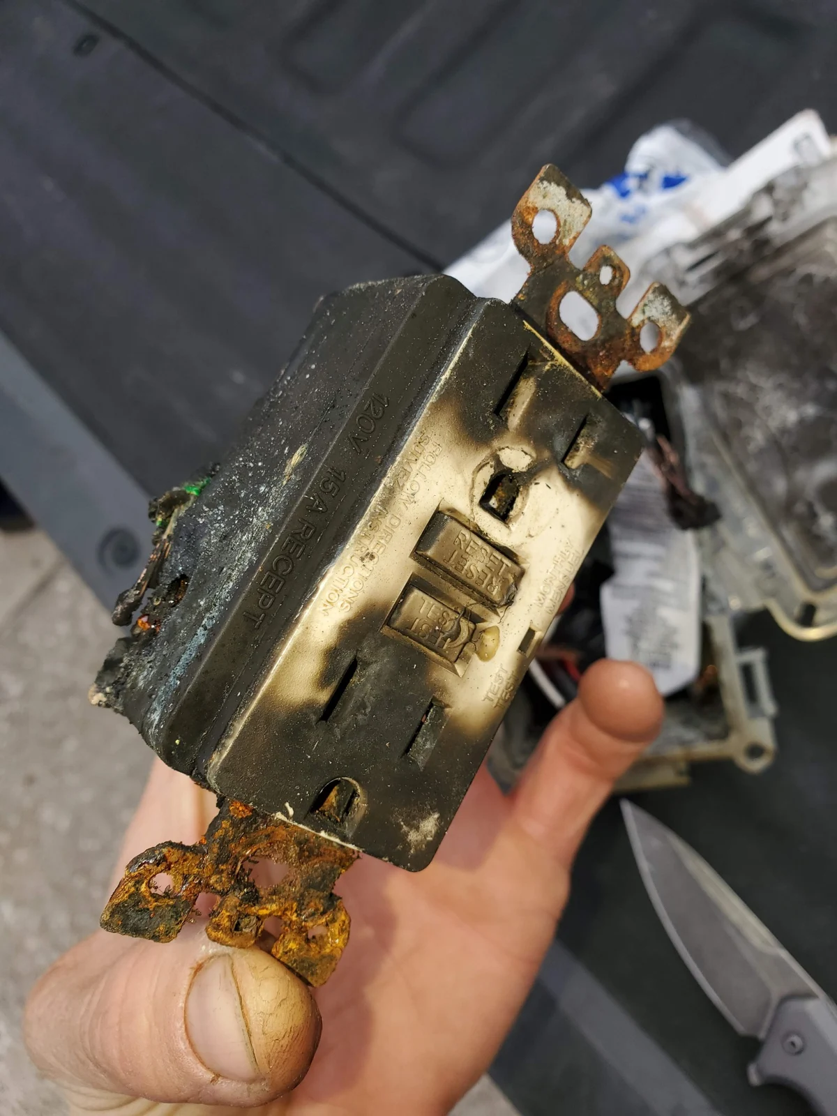Receptacle wiring condition documented during a service visit